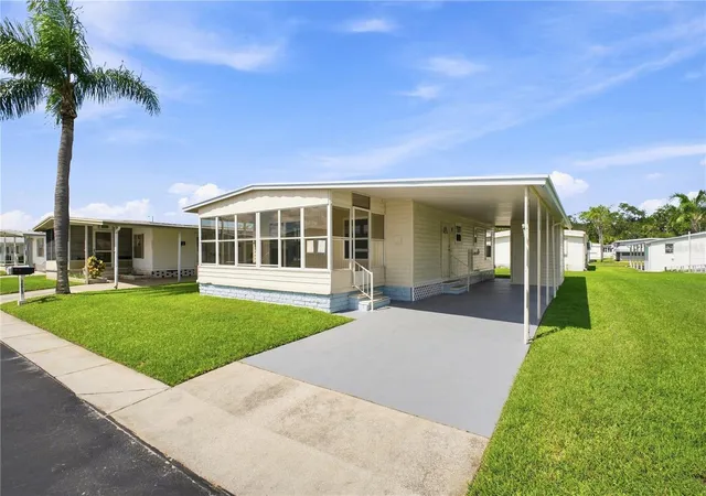 Photo 2 of Manufactured home for sale at 10913 Justice Dr, Port Richey, FL 34668 | MLS# TB8537529 | Listing updated on 2026-08-31