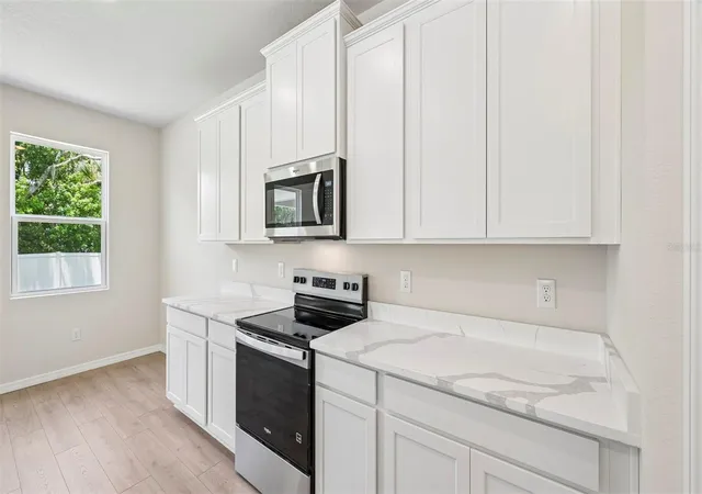 Photo 4 of Single family home for sale at 10437 Woodland Garden Way, Parrish, FL 34219 | MLS# A4702792 | Listing updated on 2026-09-02