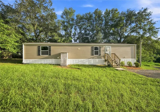 Photo 3 of Manufactured home for sale at 11945 Se 99th Court, Belleview, FL 34420 | MLS# OM730363 | Listing updated on 2026-09-20