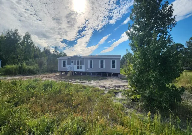 Photo 2 of Manufactured home for sale at 1636 Mistletoe St, Bunnell, FL 32110 | MLS# O6433395 | Listing updated on 2026-10-23