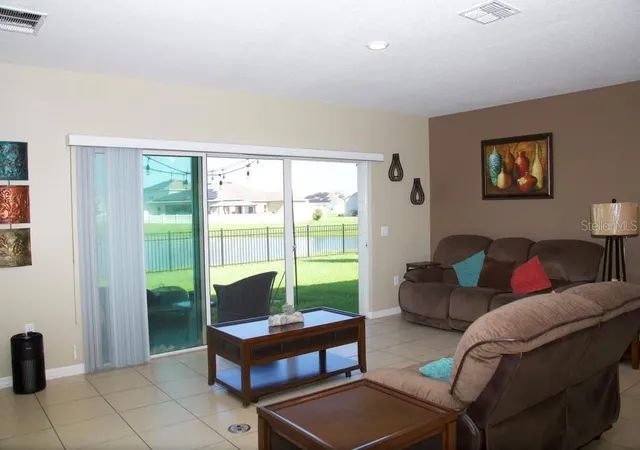 Photo 4 of Single family home for sale at 411 Blue Lake Cir, Kissimmee, FL 34758 | MLS# O6433405 | Listing updated on 2026-08-15