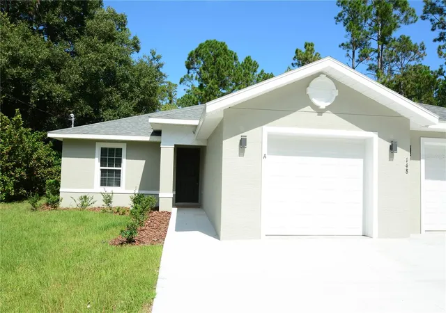 Photo 2 of Multi family home for sale at 148 Secretary Trl #A/B, Palm Coast, FL 32164 | MLS# FC320680 | Listing updated on 2026-09-23