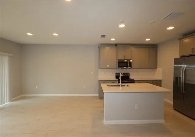 Photo 1 of Townhouse for sale at 6104 Fellow Wagon Way, Orlando, FL 32822 | MLS# O6433671 | Listing updated on 2026-09-11