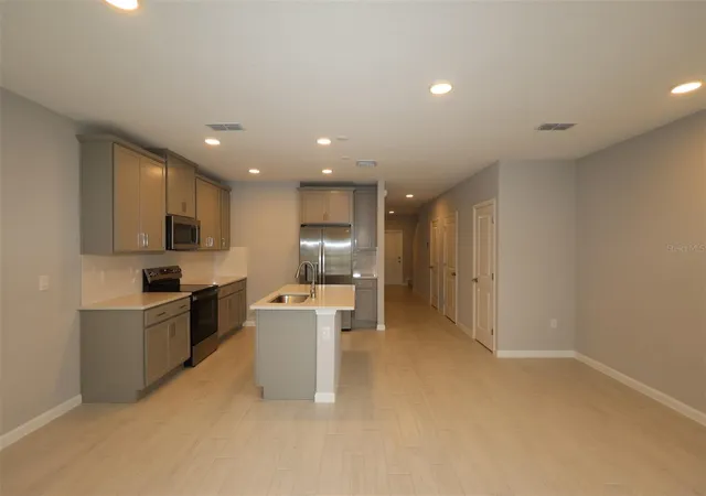 Photo 4 of Townhouse for sale at 6104 Fellow Wagon Way, Orlando, FL 32822 | MLS# O6433671 | Listing updated on 2026-09-11