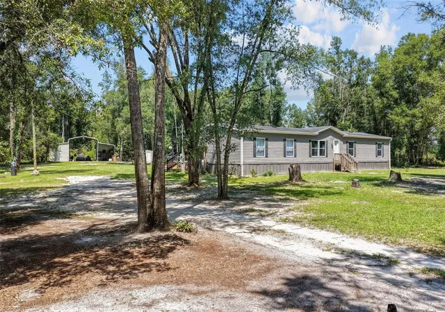 Photo 1 of Manufactured home for sale at 140 Sw Spaulding Ct, Fort White, FL 32038 | MLS# GC542757 | Listing updated on 2026-10-21