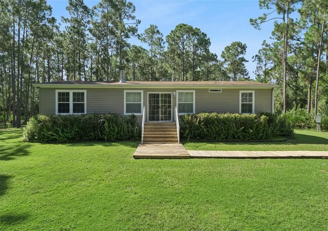 Photo 3 of Manufactured home for sale at 1161 Lake Harney Woods Blvd, Mims, FL 32754 | MLS# O6433877 | Listing updated on 2026-09-30