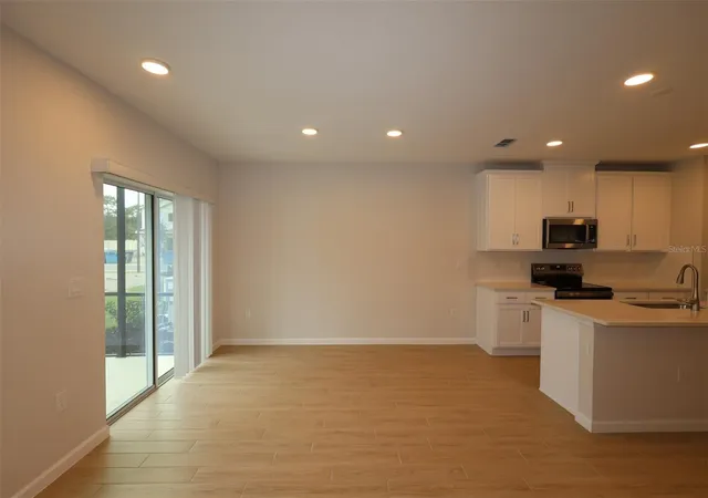 Photo 4 of Townhouse for sale at 6108 Fellow Wagon Way, Orlando, FL 32822 | MLS# O6434118 | Listing updated on 2026-09-11