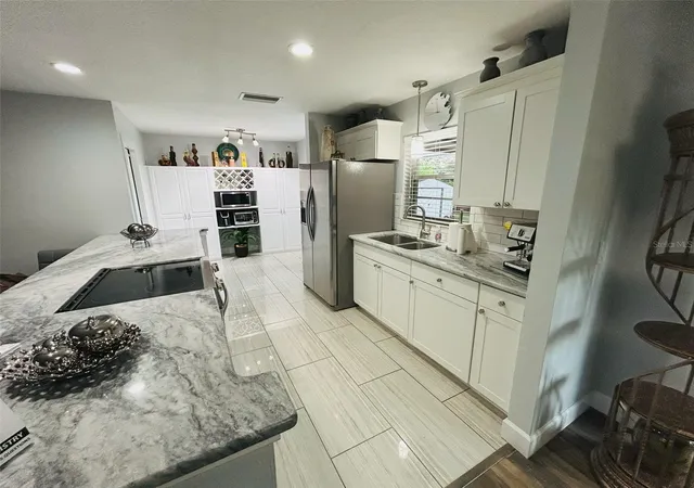 Photo 4 of Single family home for sale at 1643 Saxon Blvd, Deltona, FL 32725 | MLS# O6435094 | Listing updated on 2026-09-12