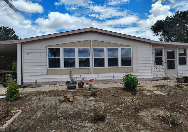 1st image of 1537 Doral Cir, Lady Lake, FL 32159 | MLS# OM730748