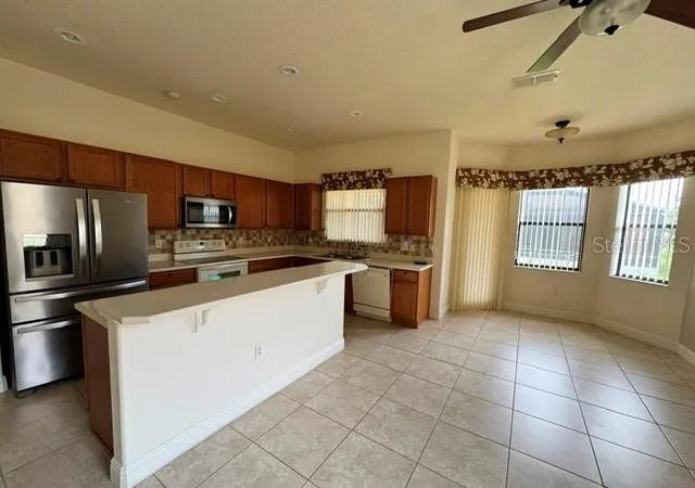 5th image of 896 Barcelona Dr, Poinciana, FL 34759 | MLS# O6435573