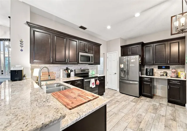 Photo 2 of Single family home for sale at 3874 Gatlin Pl Cir, Orlando, FL 32812 | MLS# O6435652 | Listing updated on 2026-10-22