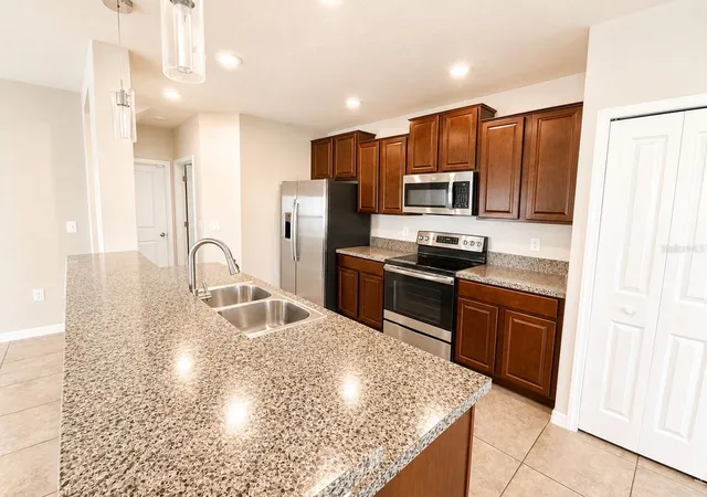Photo 4 of Single family home for sale at 7422 Evening Primrose Ct, Tampa, FL 33619 | MLS# TB8541323 | Listing updated on 2026-10-02