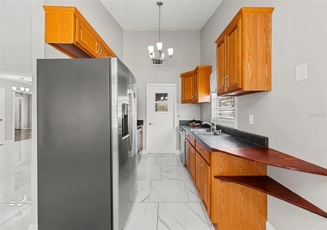 Photo 4 of Single family home for sale at 3878 Feather Dr, Lakeland, FL 33812 | MLS# TB8541736 | Listing updated on 2026-09-30