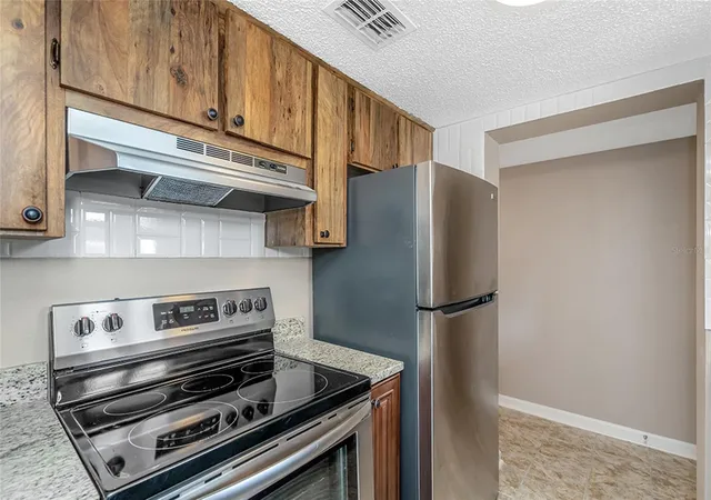 Listing Photo 5 - Condo for sale in building located at 5521 Bay Blvd, Port Richey, FL 34668 - Unit #104