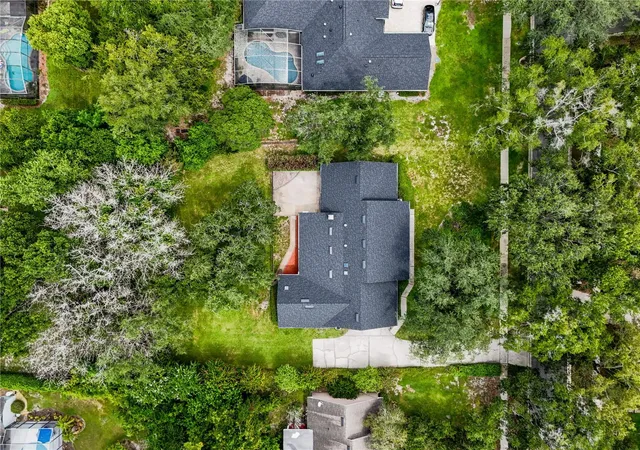 Photo 3 of Single family home for sale at 7141 Wooded Village Ln, Orlando, FL 32835 | MLS# O6436400 | Listing updated on 2026-09-13