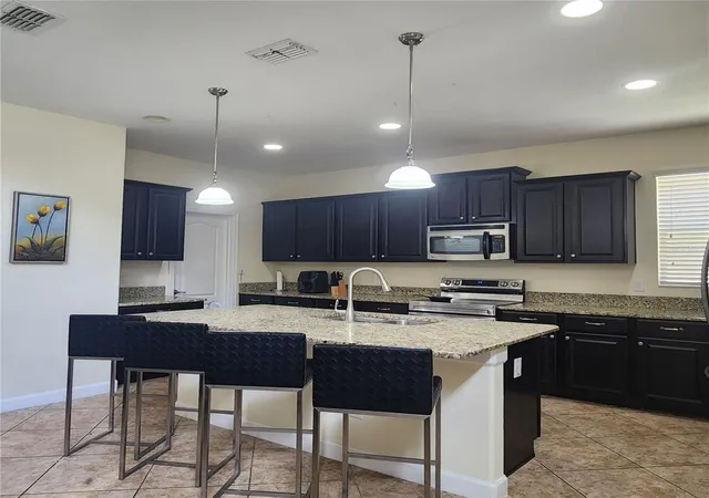 Photo 2 of Single family home for sale at 8935 Cuban Palm Rd, Kissimmee, FL 34747 | MLS# O6436601 | Listing updated on 2026-09-13