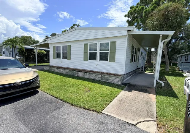 Photo 2 of Manufactured home for sale at 2068 Ca D Oro Dr, Sarasota, FL 34238 | MLS# TB8542611 | Listing updated on 2026-09-04