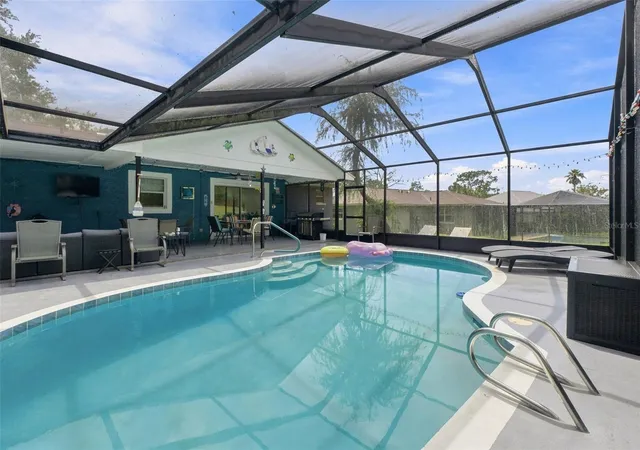Photo 3 of Single family home for sale at 12411 Brookside St, Spring Hill, FL 34609 | MLS# W7888951 | Listing updated on 2026-08-27