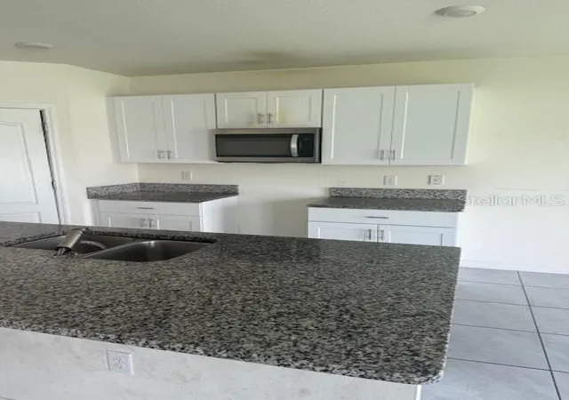 Photo 4 of Single family home for sale at 1550 Oak Reserve Dr, Kissimmee, FL 34744 | MLS# O6437198 | Listing updated on 2026-08-29