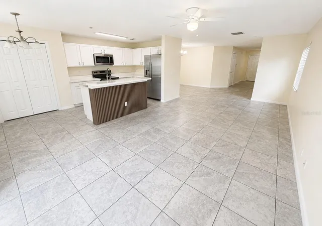 Photo 2 of Townhouse for sale at 13507 Tea Rose Wy #128, Orlando, FL 32824 | MLS# O6437250 | Listing updated on 2026-10-06