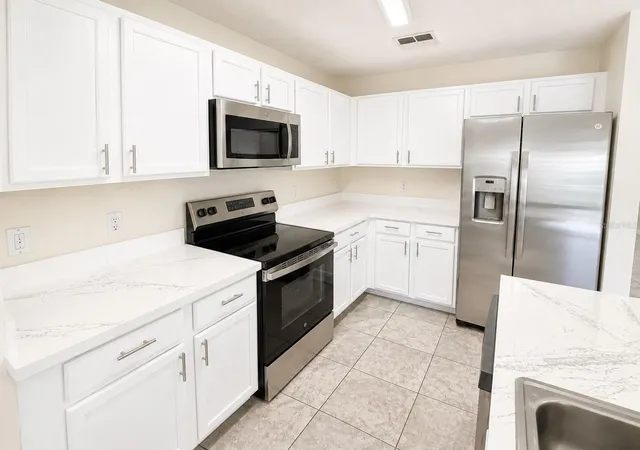 Photo 3 of Townhouse for sale at 13507 Tea Rose Wy #128, Orlando, FL 32824 | MLS# O6437250 | Listing updated on 2026-10-06