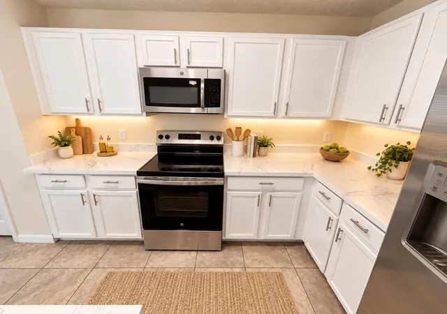 Photo 3 of Townhouse for sale at 13507 Tea Rose Wy #128, Orlando, FL 32824 | MLS# O6437250 | Listing updated on 2026-10-12