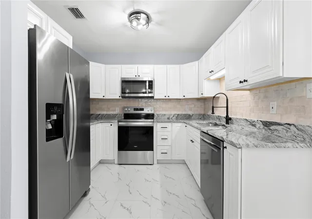 Photo 3 of Single family home for sale at 3921 W Gray St, Tampa, FL 33609 | MLS# TB8543305 | Listing updated on 2026-10-11