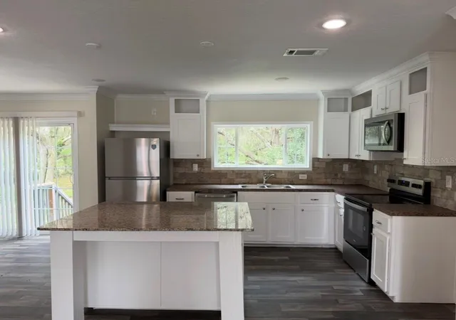 Photo 2 of Manufactured home for sale at 34627 Radio Rd, Leesburg, FL 34788 | MLS# GC543080 | Listing updated on 2026-09-21