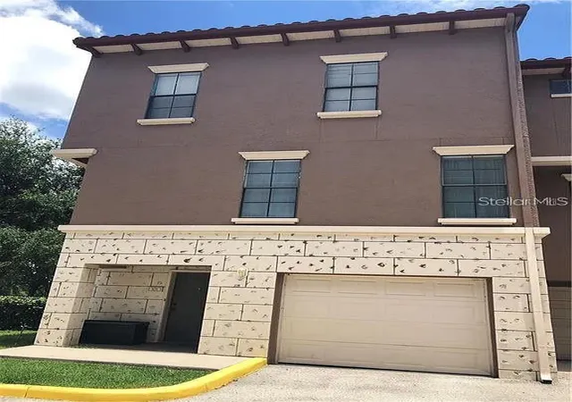 Photo 1 of Townhouse for sale at 6129 Metrowest Blvd #101, Orlando, FL 32835 | MLS# O6437410 | Listing updated on 2026-08-29