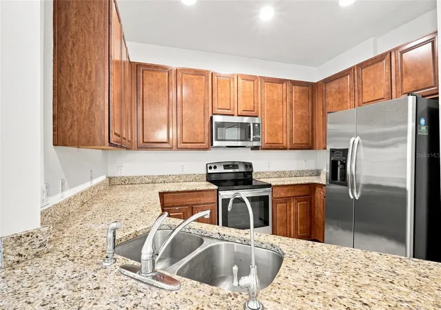 Photo 3 of Townhouse for sale at 13613 Eridanus Dr, Orlando, FL 32828 | MLS# O6437453 | Listing updated on 2026-09-23