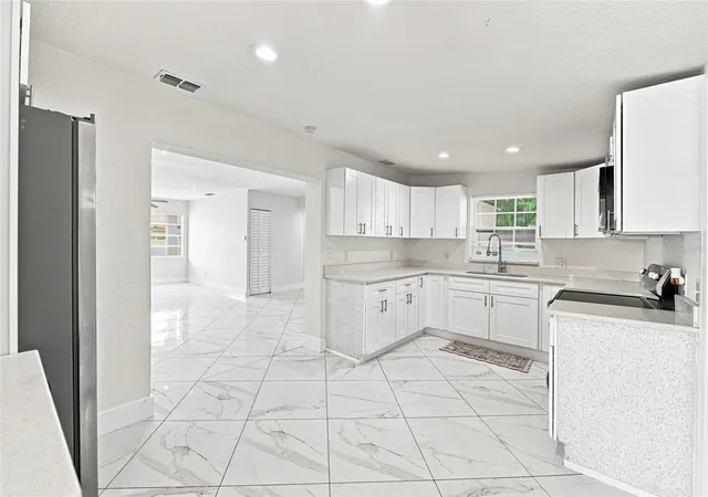 Photo 4 of Single family home for sale at 7805 Winston Ln, Tampa, FL 33615 | MLS# TB8543580 | Listing updated on 2026-09-23