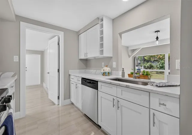 Photo 3 of Single family home for sale at 312 Reading St NW, Port Charlotte, FL 33952 | MLS# A4704491 | Listing updated on 2026-09-12