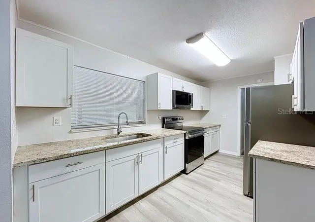 Photo 3 of Single family home for sale at 2358 Mariner Blvd, Spring Hill, FL 34609 | MLS# TB8543872 | Listing updated on 2026-10-08