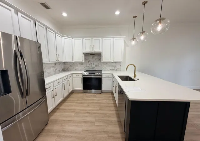 Photo 3 of Multi family home for sale at 2013 E Esther St, Orlando, FL 32806 | MLS# O6437752 | Listing updated on 2026-09-01