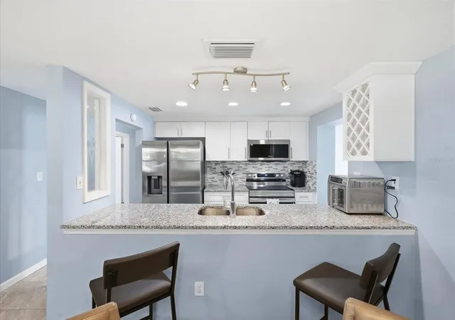 Photo 4 of Single family home for sale at 7312 S Elliott St, Tampa, FL 33616 | MLS# TB8543997 | Listing updated on 2026-09-05