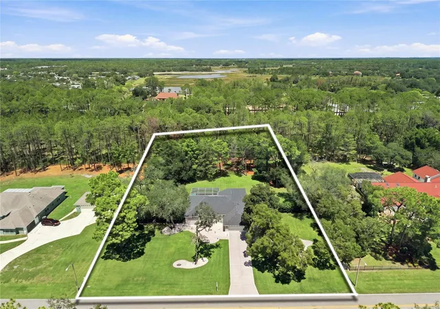 Photo 2 of Single family home for sale at 10261 Woodland Waters Blvd, Weeki Wachee, FL 34613 | MLS# W7889067 | Listing updated on 2026-09-16