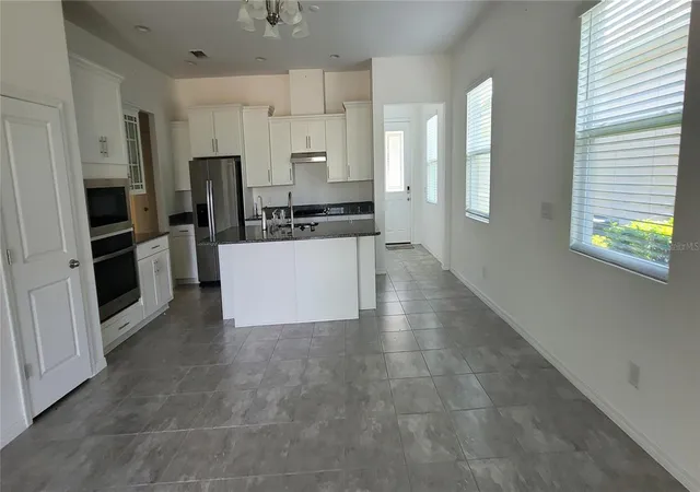 Photo 2 of Single family home for sale at 1908 Flora Pass Pl, Kissimmee, FL 34747 | MLS# O6437912 | Listing updated on 2026-09-01