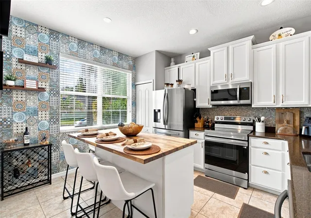 Photo 2 of Single family home for sale at 14310 Queenside St, Orlando, FL 32824 | MLS# O6438074 | Listing updated on 2026-09-13