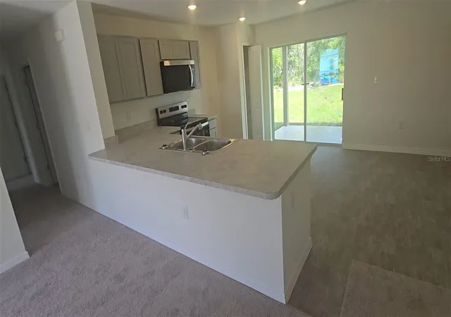 Photo 2 of Single family home for sale at 100 Willow Dr, Kissimmee, FL 34759 | MLS# C7530217 | Listing updated on 2026-09-02