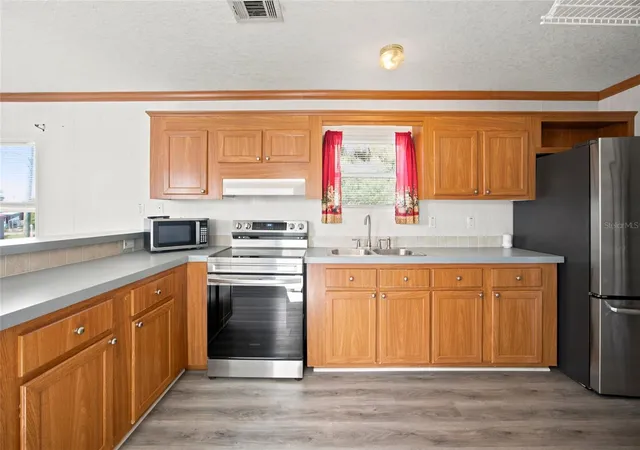 Photo 3 of Manufactured home for sale at 10265 Se 165th Place, Summerfield, FL 34491 | MLS# OM731464 | Listing updated on 2026-09-04