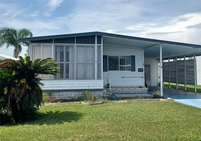 Photo 2 of Manufactured home for sale at 34620 Sweetpea Ln, Zephyrhills, FL 33541 | MLS# TB8544617 | Listing updated on 2026-09-08