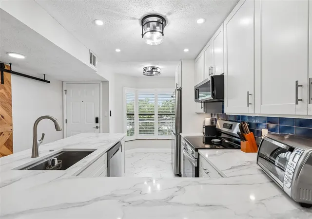 Listing Photo 4 - Condo for sale in building located at 1332 Pasadena Ave S, ST PETERSBURG, FL 33707 - Unit #207