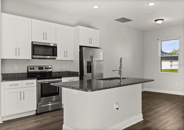 Photo 4 of Single family home for sale at 1125 Munster Ct, Kissimmee, FL 34759 | MLS# O6438920 | Listing updated on 2026-10-12