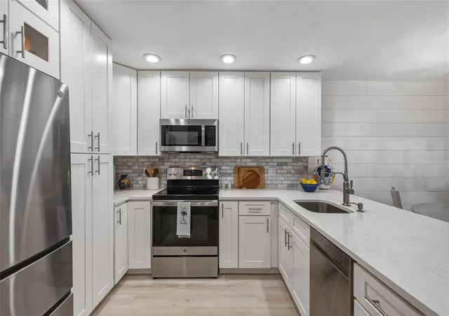 Listing Photo 5 - Condo for sale in building located at 230 Medallion Blvd, Madeira Beach, FL 33708 - Unit #F