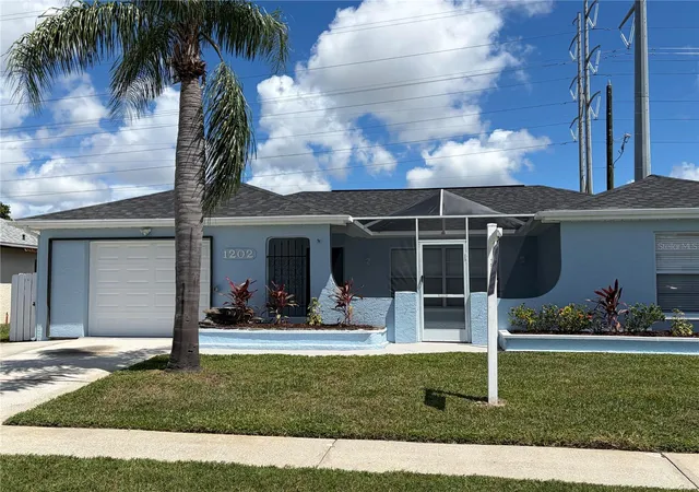 Photo 2 of Single family home for sale at 1202 Mandarin Dr, Holiday, FL 34691 | MLS# W7889213 | Listing updated on 2026-10-06