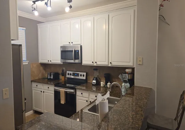 Photo 2 of Condo for sale at 910 Charo Pkwy #323, Davenport, FL 33897 | MLS# O6439224 | Listing updated on 2026-09-26