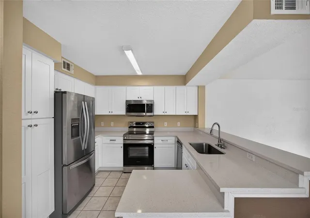 Photo 4 of Condo for sale at 14013 Fairway Is Dr #428, Orlando, FL 32837 | MLS# O6439322 | Listing updated on 2026-09-05