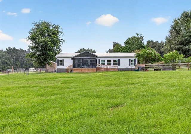 Photo 3 of Manufactured home for sale at 4256 SE 150th Street, Summerfield, FL 34491 | MLS# OM731751 | Listing updated on 2026-09-23