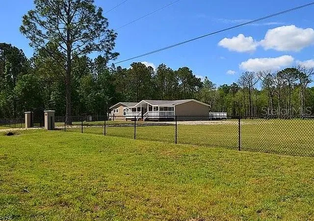Photo 2 of Manufactured home for sale at 307 Country World Dr W, Davenport, FL 33897 | MLS# O6439437 | Listing updated on 2026-10-08