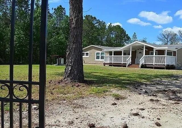 Photo 3 of Manufactured home for sale at 307 Country World Dr W, Davenport, FL 33897 | MLS# O6439437 | Listing updated on 2026-10-08